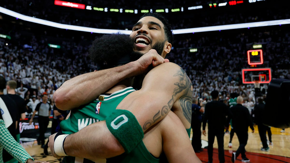 Derrick White and Jayson Tatum hug