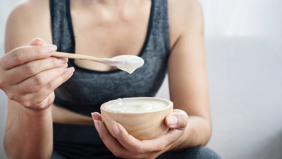 Woman eating yogurt