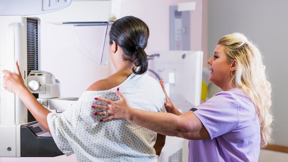 Woman getting mammogram