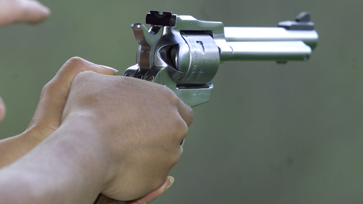 revolver in a person's hands, closeup shot