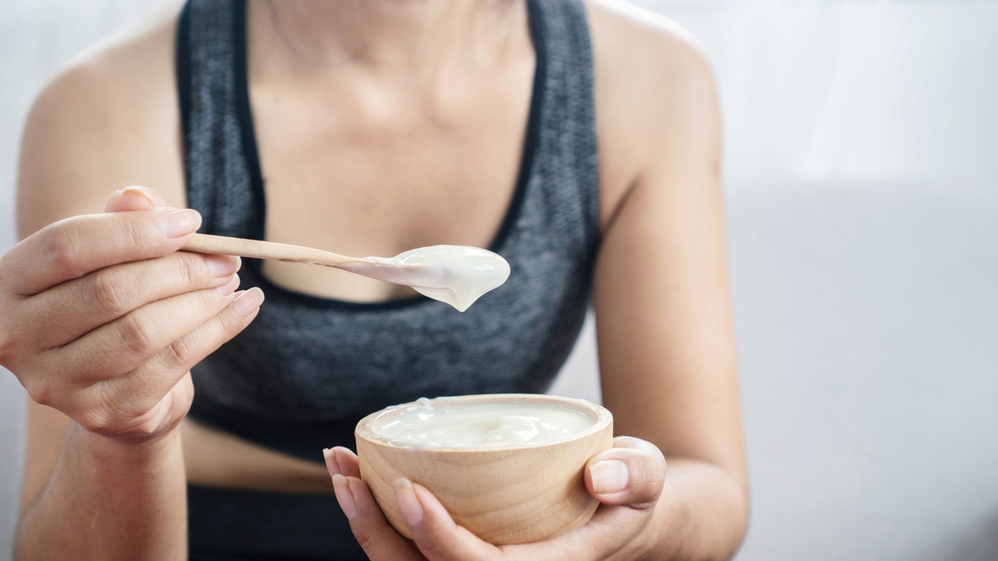 woman eating yogurt