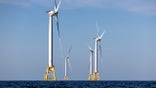 AT SEA - JULY 07: Wind turbines generate electricity at the Block Island Wind Farm on July 07, 2022 near Block Island, Rhode Island. The first commercial offshore wind farm in the United States is located 3.8 miles from Block Island, Rhode Island in the Atlantic Ocean. The five-turbine, 30 MW project was developed by Deepwater Wind and began operations in December, 2016 at a cost of nearly $300 million. (Photo by John Moore/Getty Images)