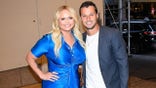 Miranda Lambert smiling with her husband Brendan McLoughlin
