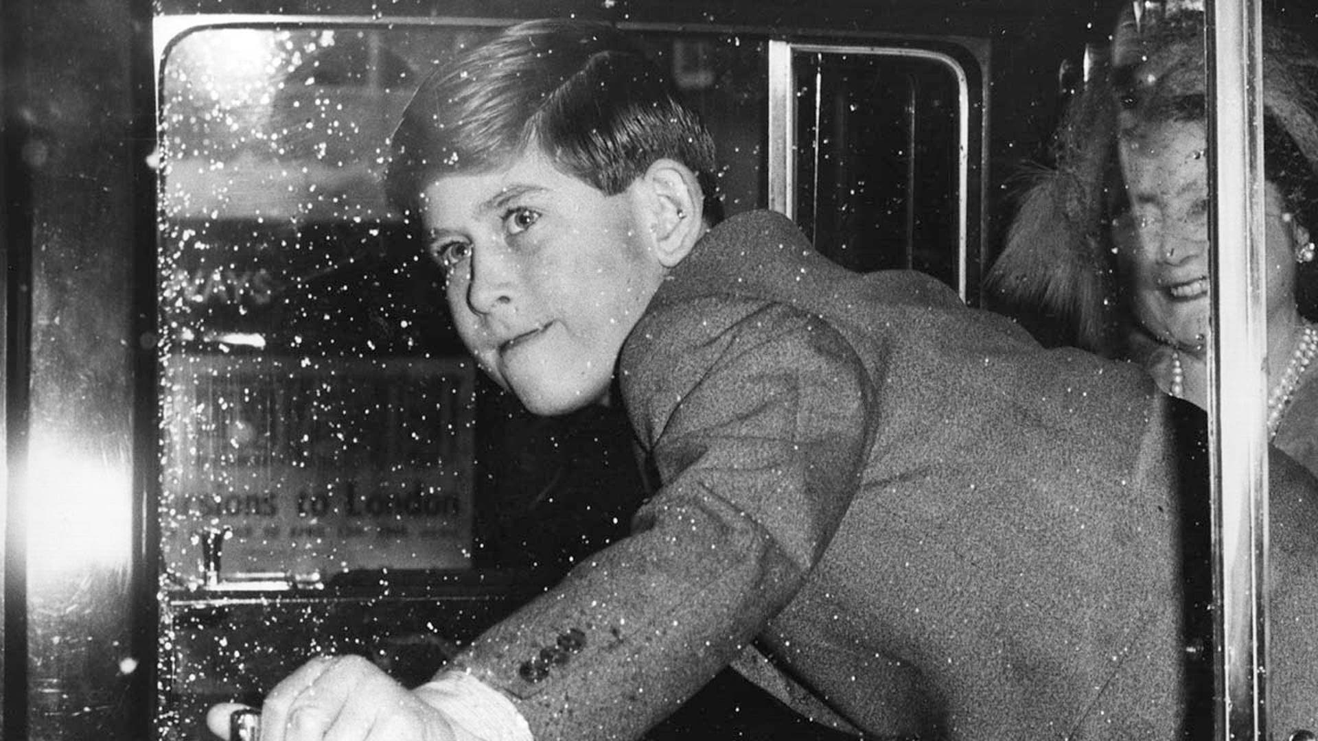 Prince Charles closing the door of a Royal car for his grandmother, Queen Elizabeth.