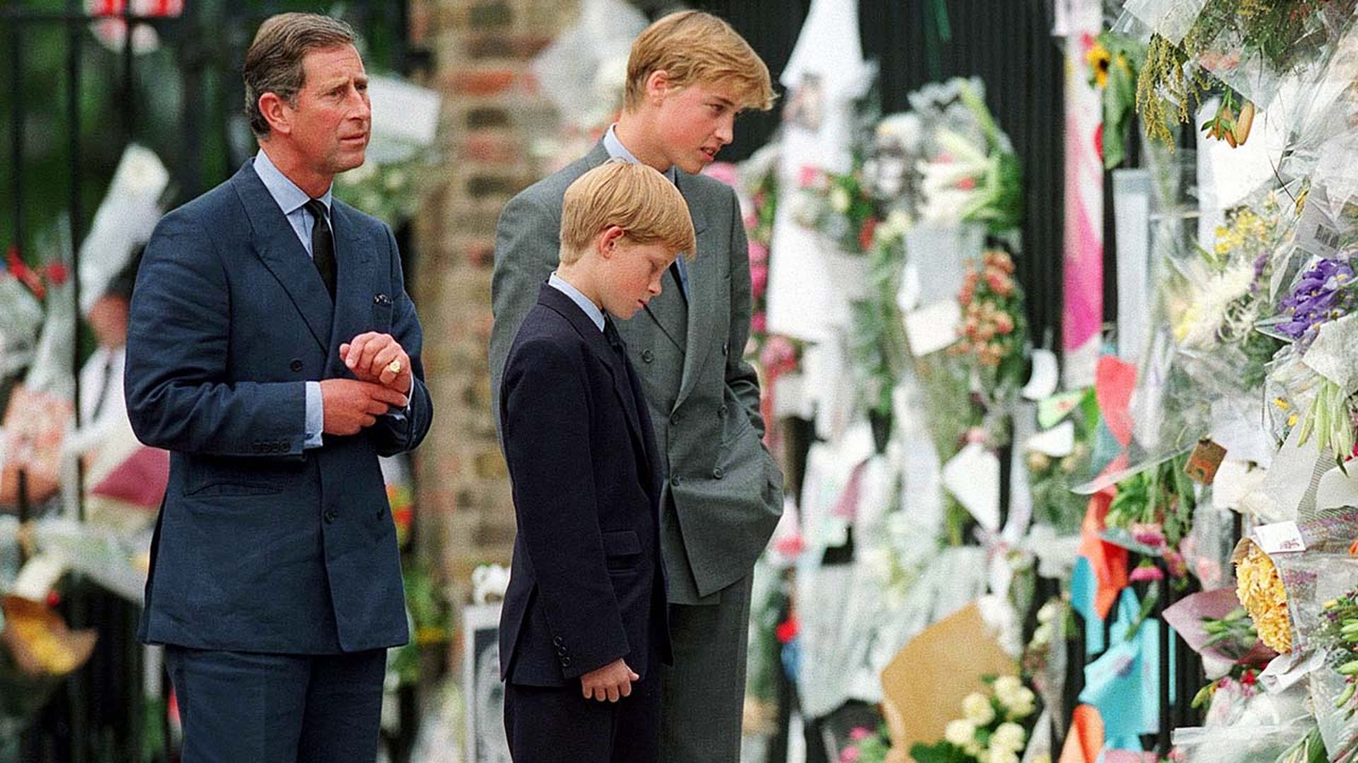 he Prince of Wales, Prince William and Prince Harry look at floral tributes to Diana, Princess of Wales outside Kensington Palace