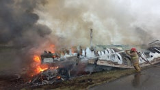 Fiery crash in northern Mexico leaves at least 26 dead after passenger van and freight truck collide