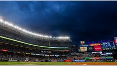 Cameraman stretchered off field after errant throw hits him in head at Yankees game