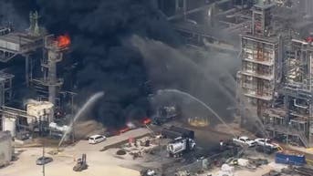 Officials tackle oil refinery fire as heavy black smoke blankets sky
