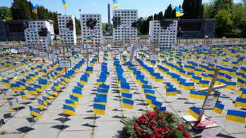 Russian ambassador's path blocked by installation representing Russian atrocities in Ukraine on Victory Day