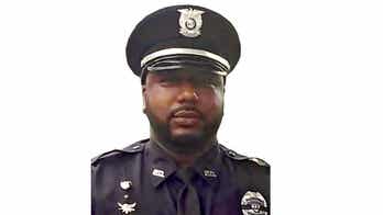 Former suburban St. Louis police officer accused of handcuffing man so his brother could beat him