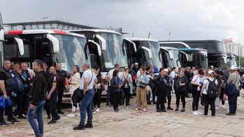 Serbians converge in country's capitol for pro-government rally following mass shootings