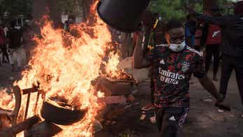 Demonstrators burn cars, police fire tear gas near Senegalese opposition leader's home
