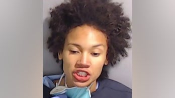 Georgia woman charged in death of 1-year-old daughter pulled from pond