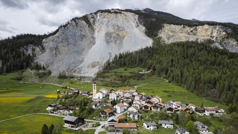 Stragglers pack up to evacuate Swiss village under urgent rockslide threat