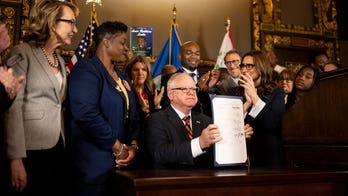 Minnesota Gov. Walz signs off on 2 gun control bills