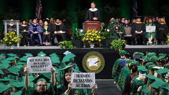 Some George Mason University students walk out, turn backs during Gov. Youngkin's commencement speech