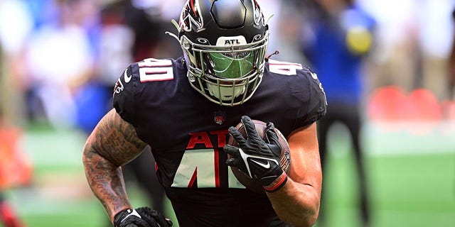 Keith Smith warms up before a Falcons game