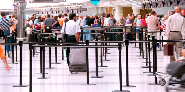 People waiting at the TSA line.