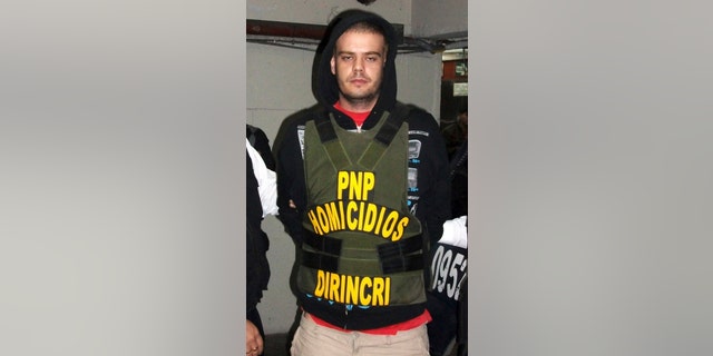 Joran Van der Sloot of the Netherlands is transferred by the police from the police headquarters to the prosecutor's office in Lima