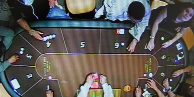 A video grab image shows Dutch Joran Van der Sloot and Peruvian Stephany Flores playing at a casino in Lima