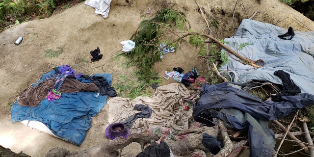 Clothes, blankets, condoms, bra, and a lighter were found on the ground