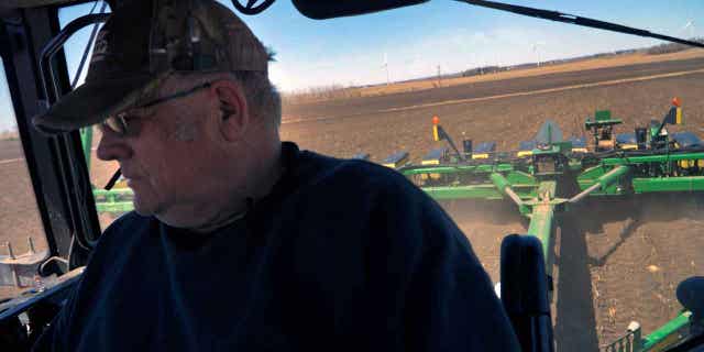 Crop farmer Bob Worth plants corn