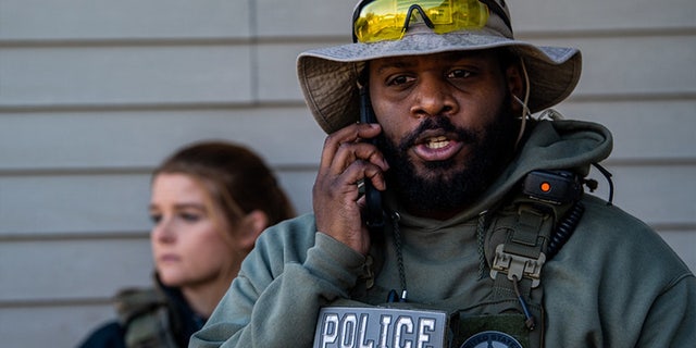 U.S. Marshal speaks on cellphone