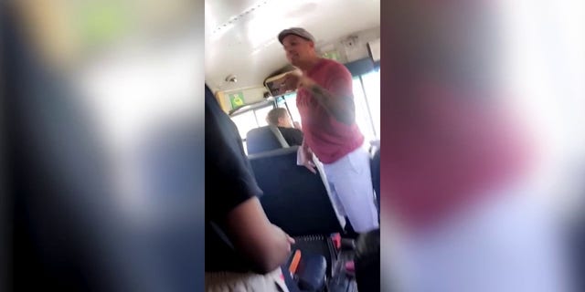 Parents seen on a bus allegedly hitting a school employee