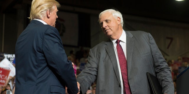 Trump and Jim Justice shake hands