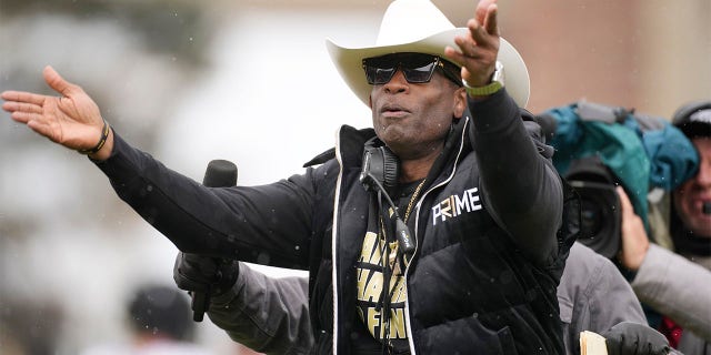 Deion Sanders coaches during the Spring Games