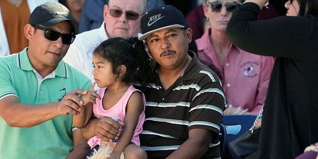 Cleveland, Texas, shooting survivor with daughter