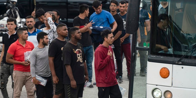 Migrant board bus in Texas