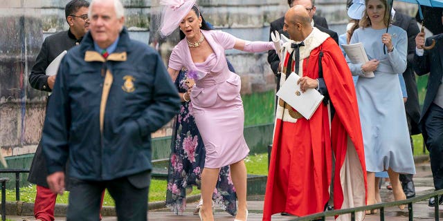 Katy Perry trips during coronation