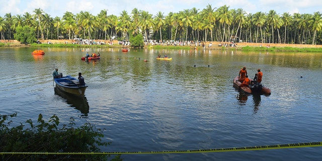 People on small boats looking for victims in the water