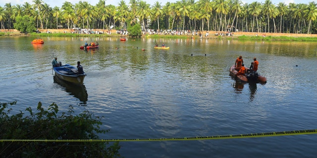 People on small boats looking for victims in the water