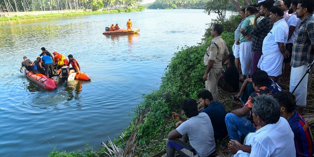 People on the shore watching the rescuers