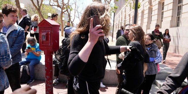 Protester arrested for throwing brick during San Francisco Mayor London Breed's chaotic open air drug hearing 2 Woman with brick at San Francisco meeting