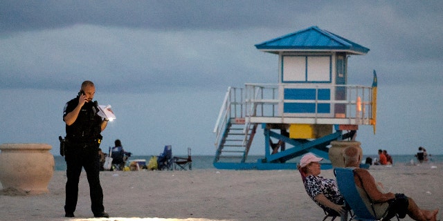 A police officer on the sand