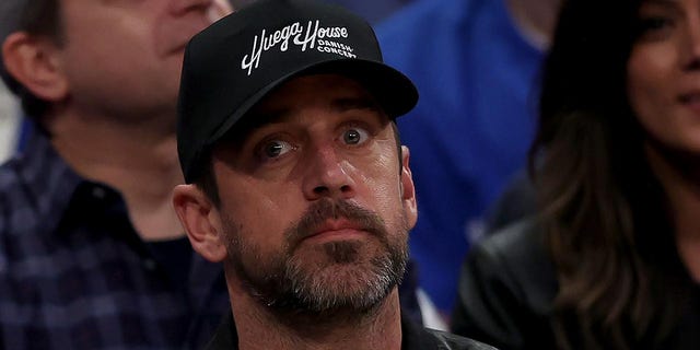 Aaron Rodgers takes in the Knicks game