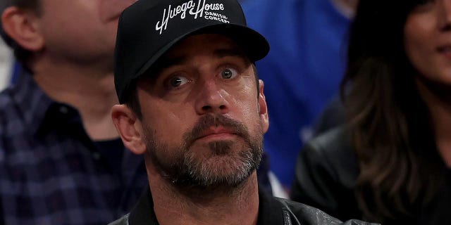 Aaron Rodgers takes in the Knicks game