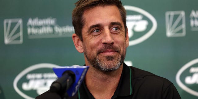 Aaron Rodgers talks to the reporters