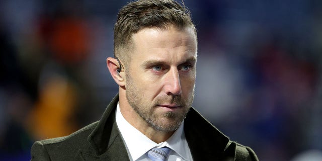 Alex Smith on an NFL field before a game