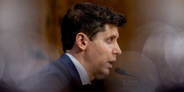 A side view of Sam Altman