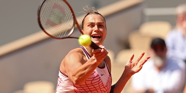 Aryna Sabalenka returns a shot