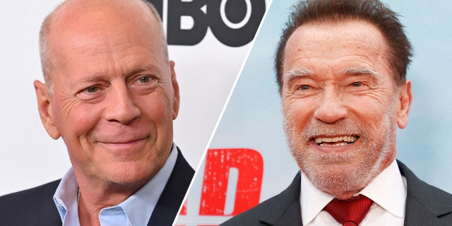 Bruce Willis grins on the red carpet in a blue shirt and black jacket, looking to his left split Arnold Schwarzenegger smiles in a white shirt, red tie, and dark suit and looks to his left
