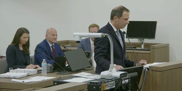 Bertolino in court blue suit