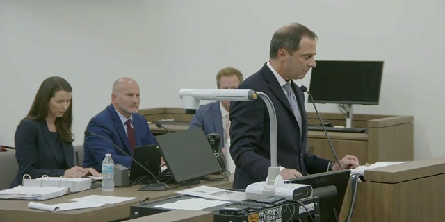 Bertolino in court blue suit