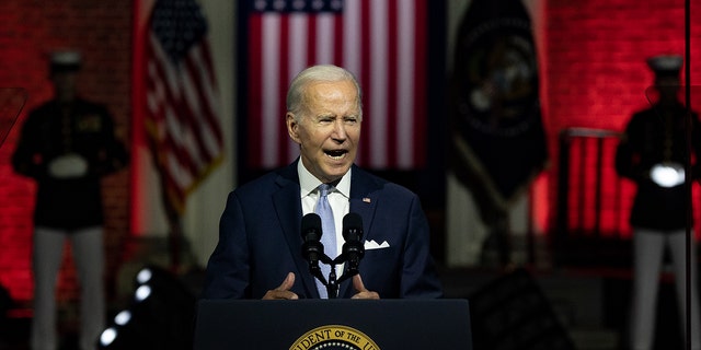 Biden at podium in nighttime speech
