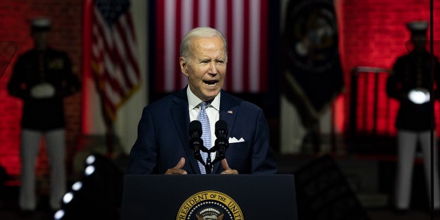 Biden at podium in nighttime speech