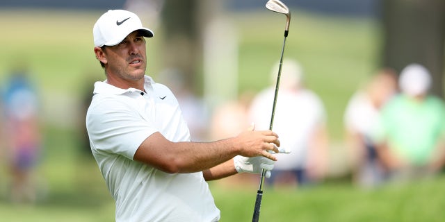 Brooks Koepka finishes swing